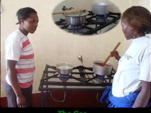 women cooking using biogas at a Biocentre
